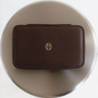 Travel Jewelry Case in Espresso on silver surface